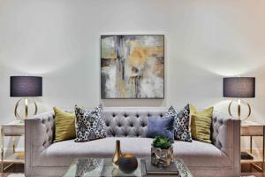 white and blue floral throw pillows on white couch